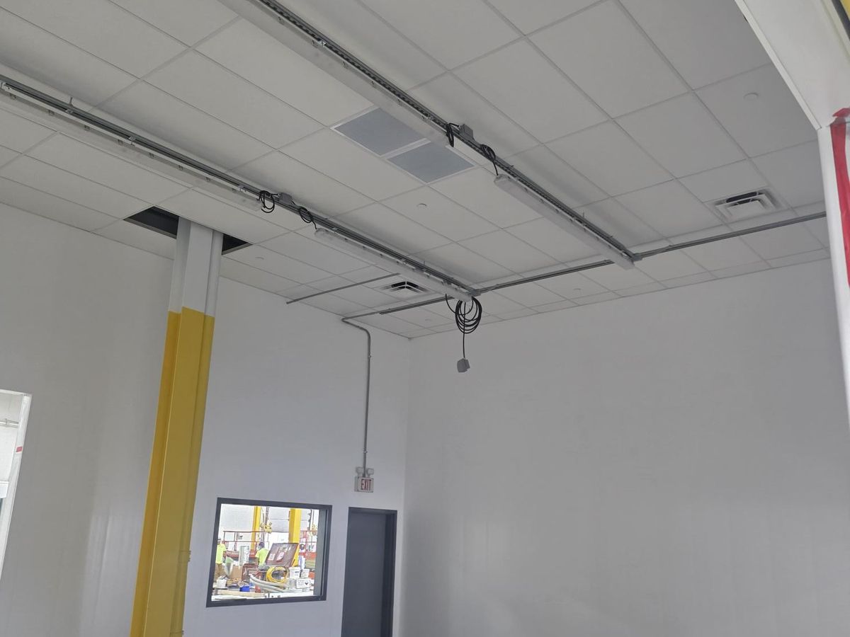 Finished interior build-out with suspended ceiling and interior service window